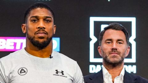A photo of boxing star Anthony Joshua and promoter Eddie Hearn