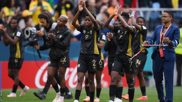 South Africa's players applaud fans after going out of the World Cup